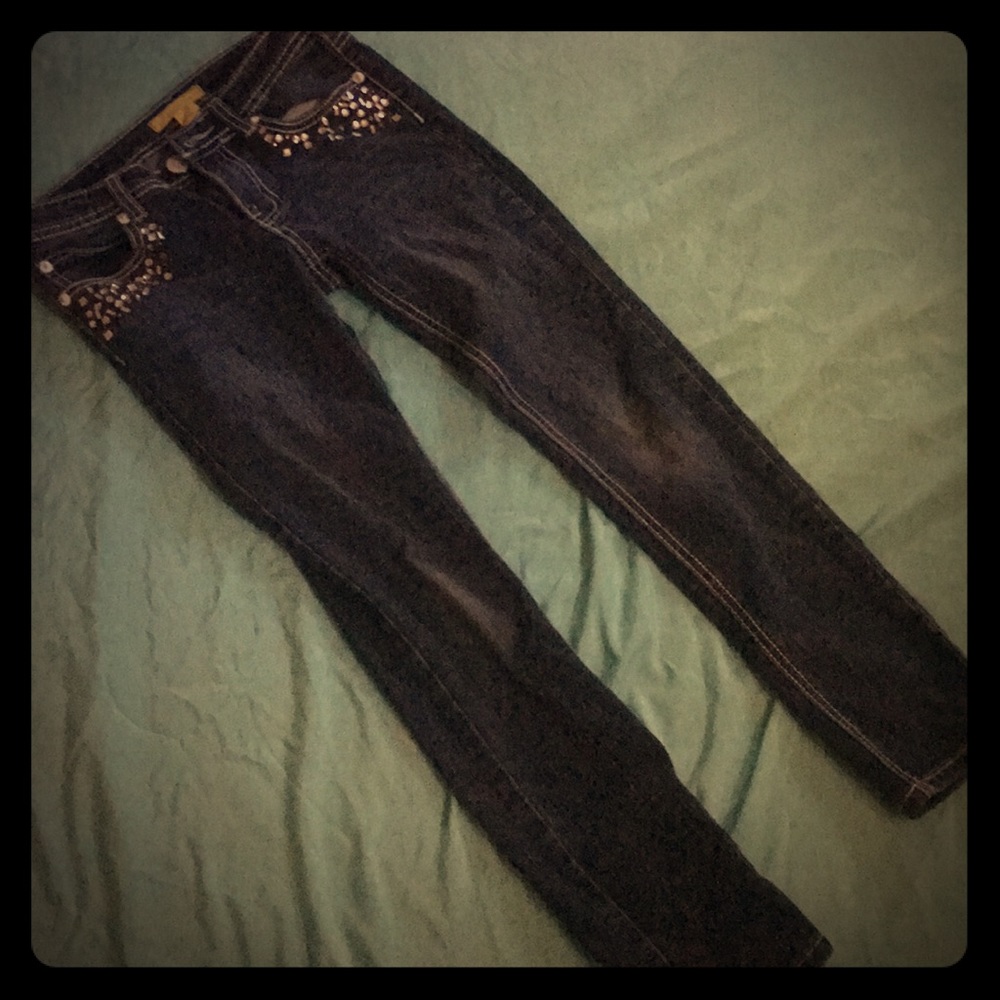 Girls skinny jeans with front pocket bling